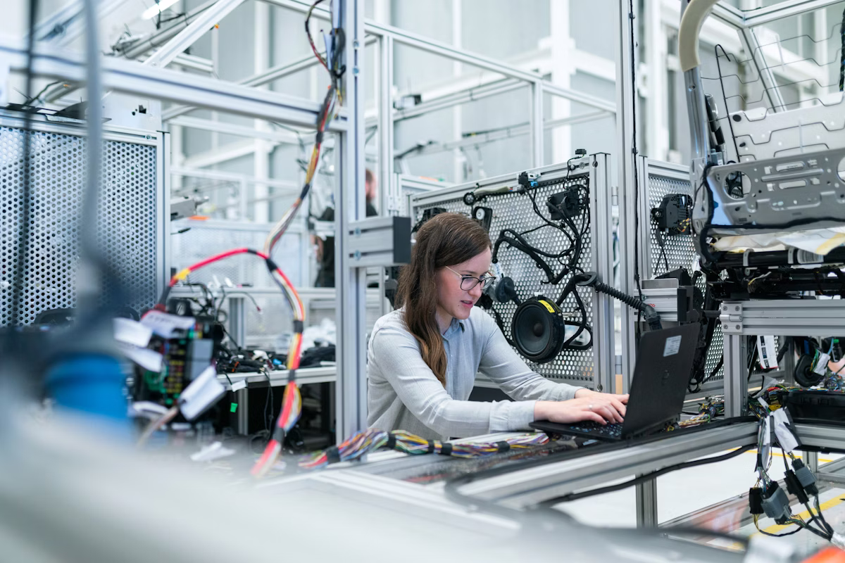 Industrial worker at manufacturing equipment